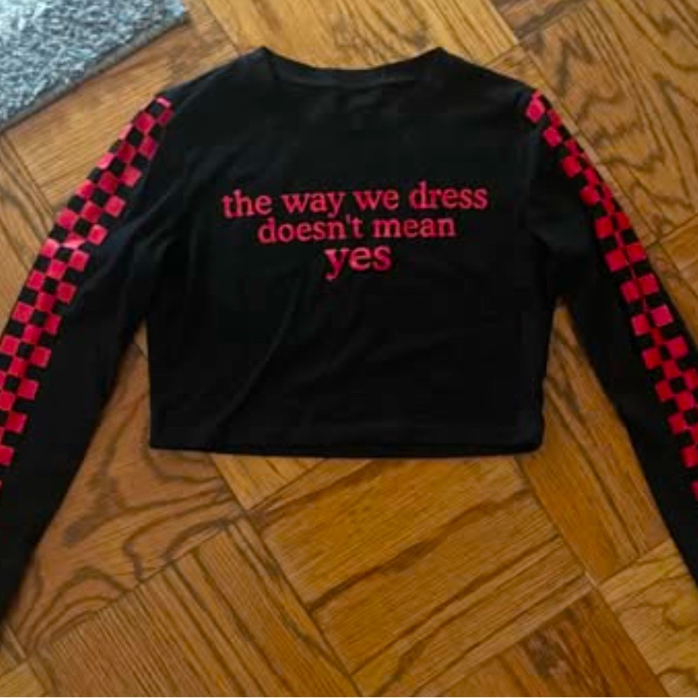 “The Way We Dress Doesn’t Mean Yes” cropped long sleeve shirt